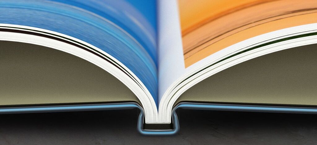 Open photo book with colorful pages, ready for personal memories.