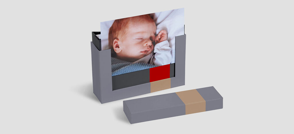 CEWE PHOTO BOOK in creative packaging shows loving memories.