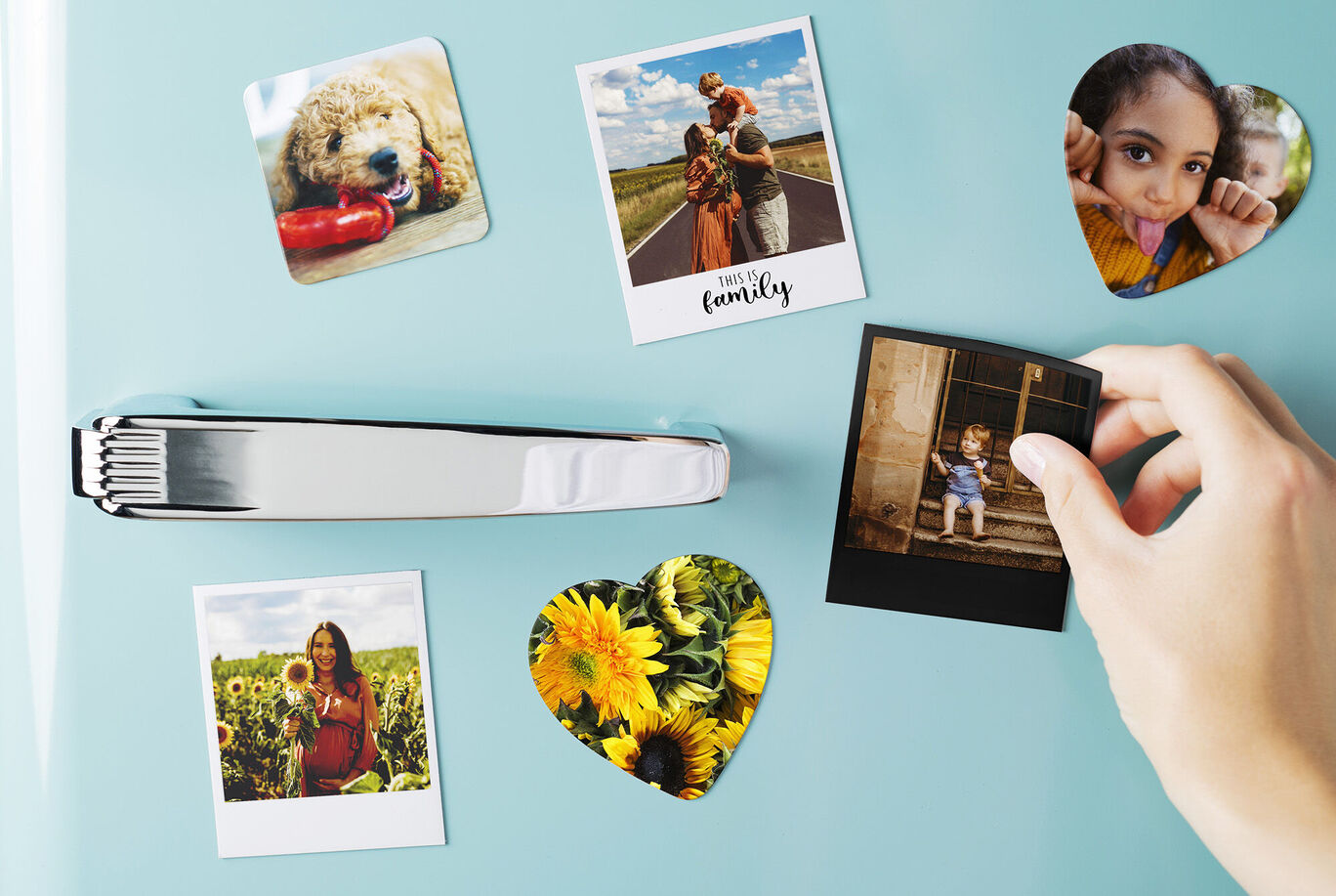Magnetic pictures on a fridge, including a photo of a mother with her child.