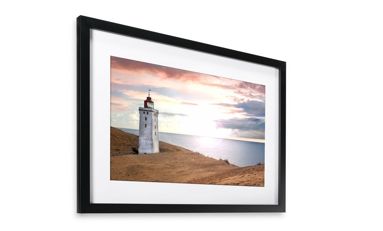 Lighthouse at the coast during sunset