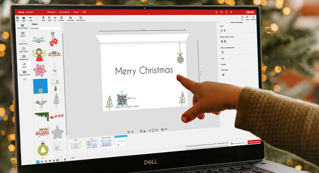 Someone designs a digital Christmas card. Elements like Christmas tree and sparkles are visible.