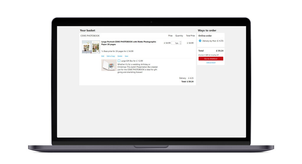 A laptop screen shows the cart of a CEWE photobook with various products and prices.