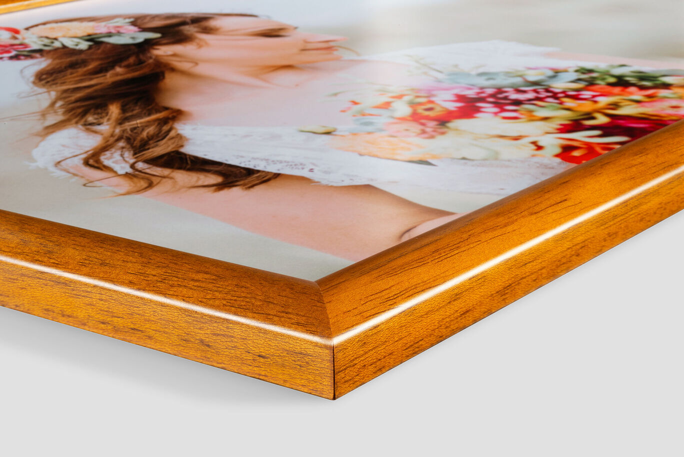 Close-up of a frameless wooden wall art with a colorful motif of a woman with a flower bouquet.
