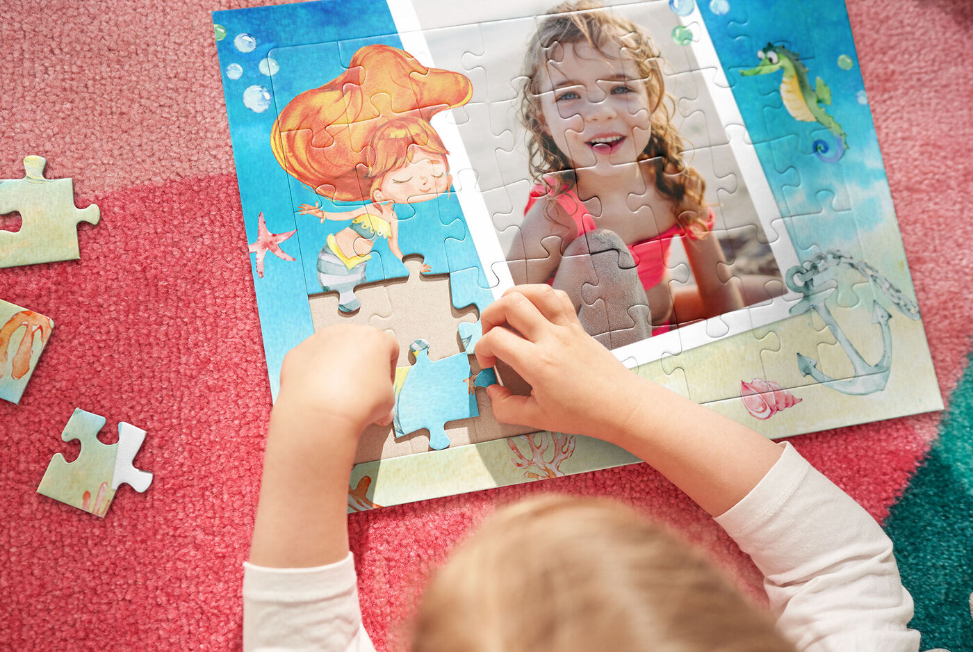 A child puzzles with a colorful picture of sea creatures and a figure.