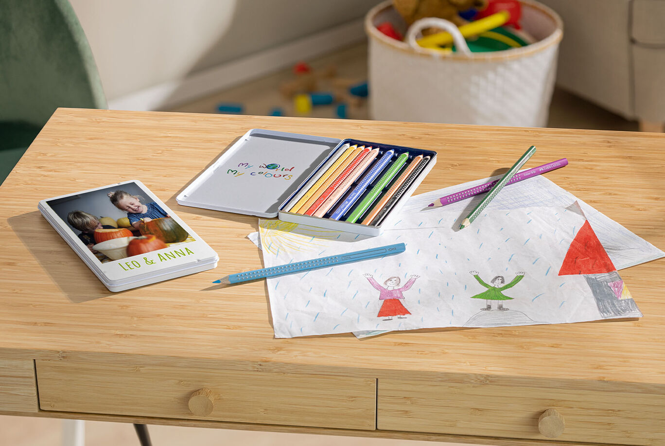 A creative crafting and painting corner with a CEWE photo book, colored pencils, and drawings. A feeling of joy and creativity.