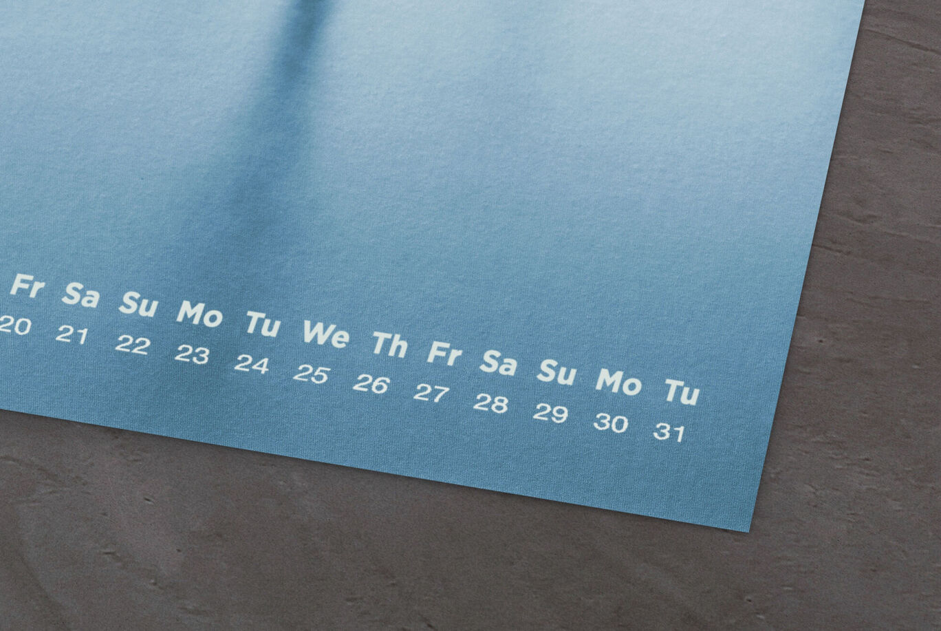 A high-quality calendar with a blue background displaying weekdays and numbers.
