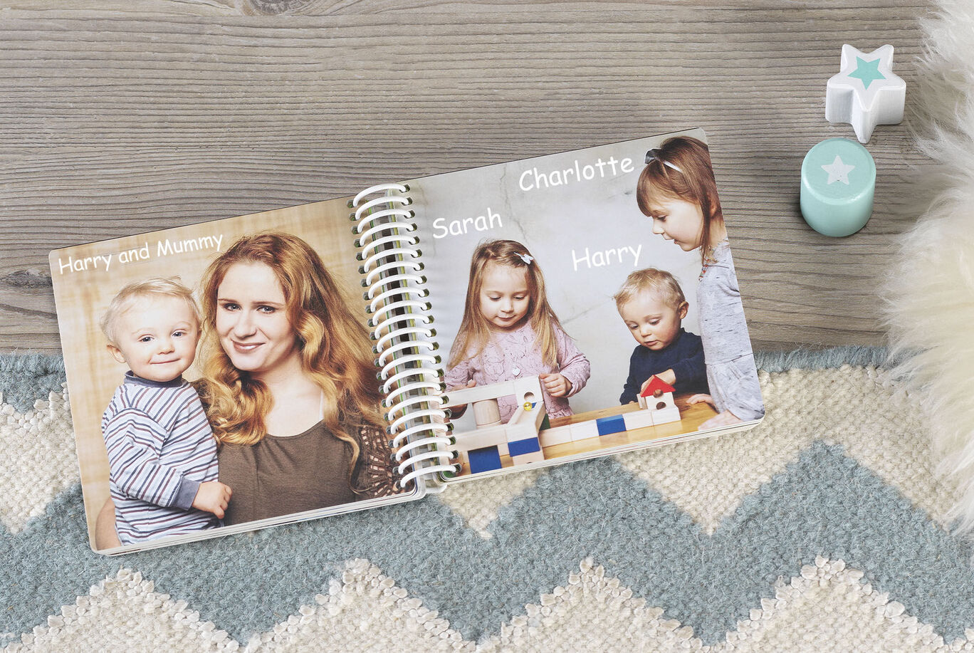 An open photo book with pictures of friends and family on a table. A toy figure and a decorative element are nearby.