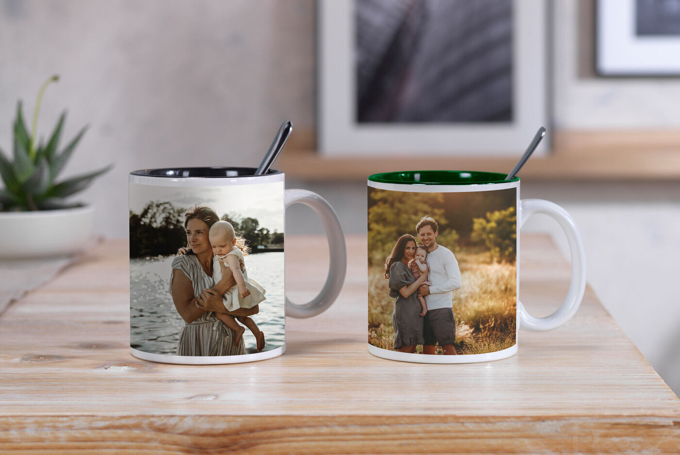 Two mugs with photos of a couple and a child, near a water body in nature.