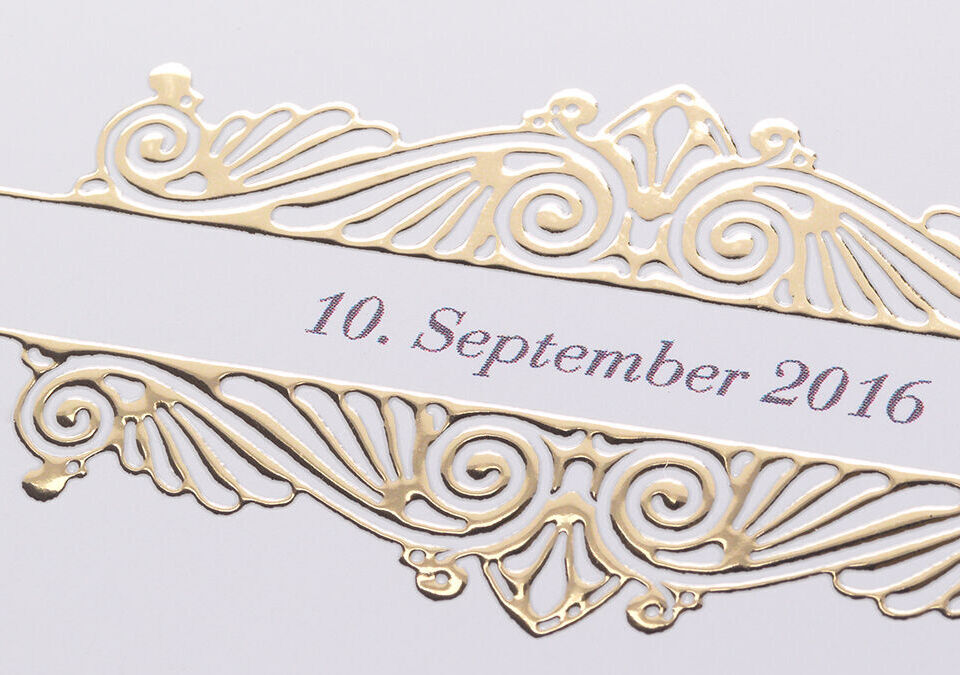 Elegant, golden decoration with the date '10th September 2016'.