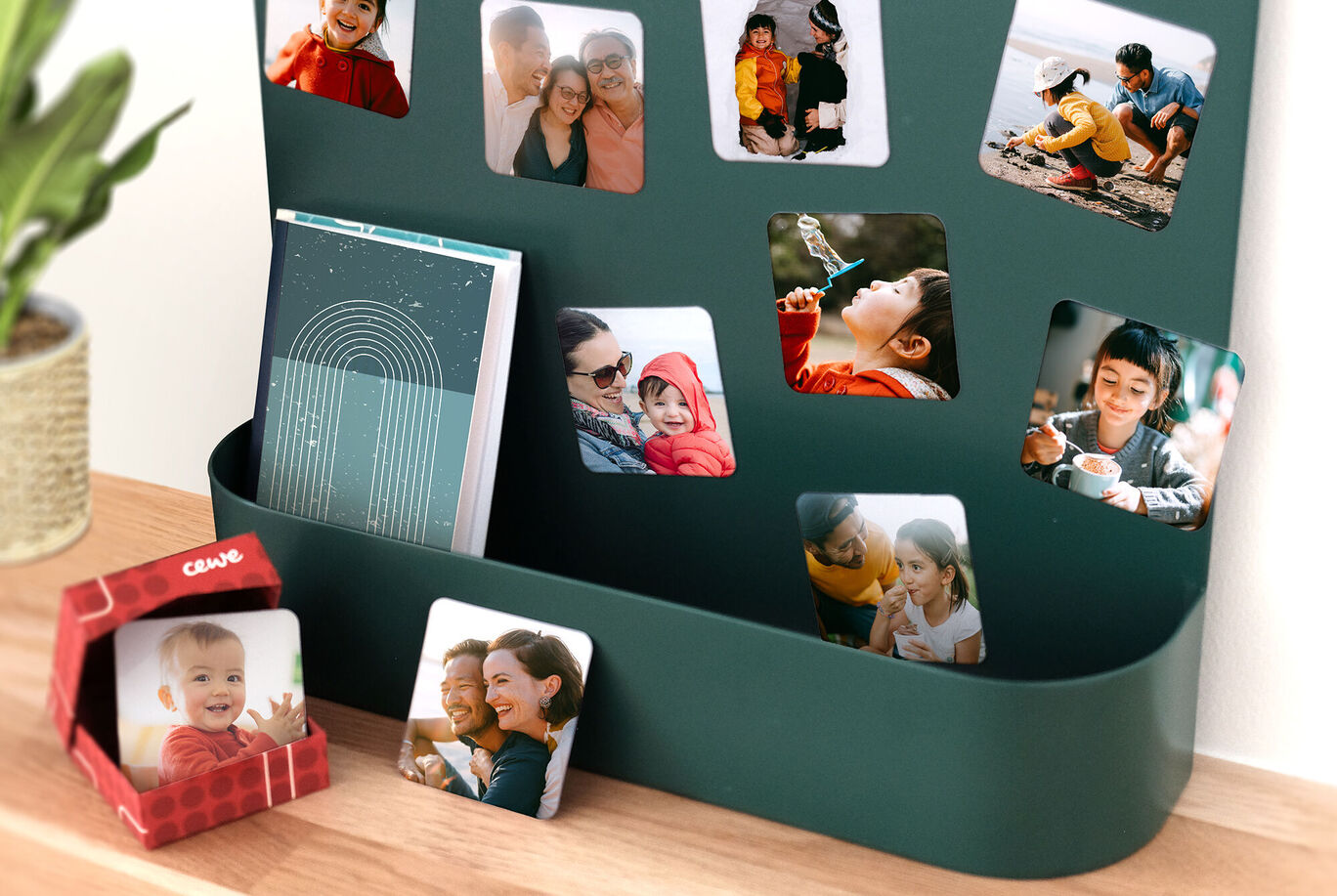 Various family photos and memories are visible on a wall mount, including a CEWE photo calendar.