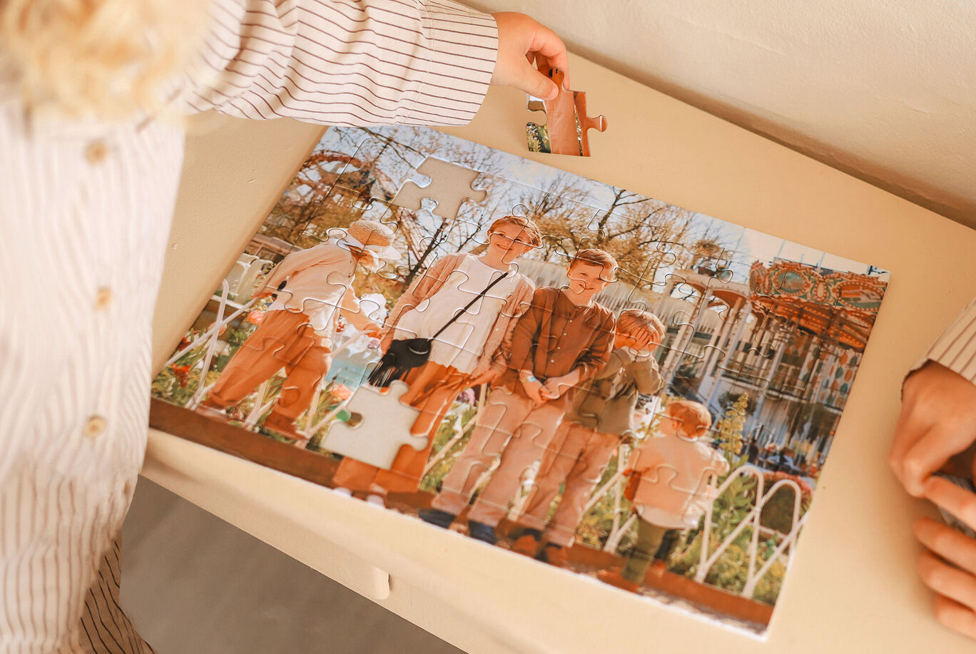 Family puzzles together on a colorful family photo.