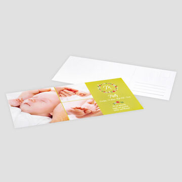 A lovingly designed greeting card featuring a sleeping baby and parents' hands surrounded by colorful flowers.