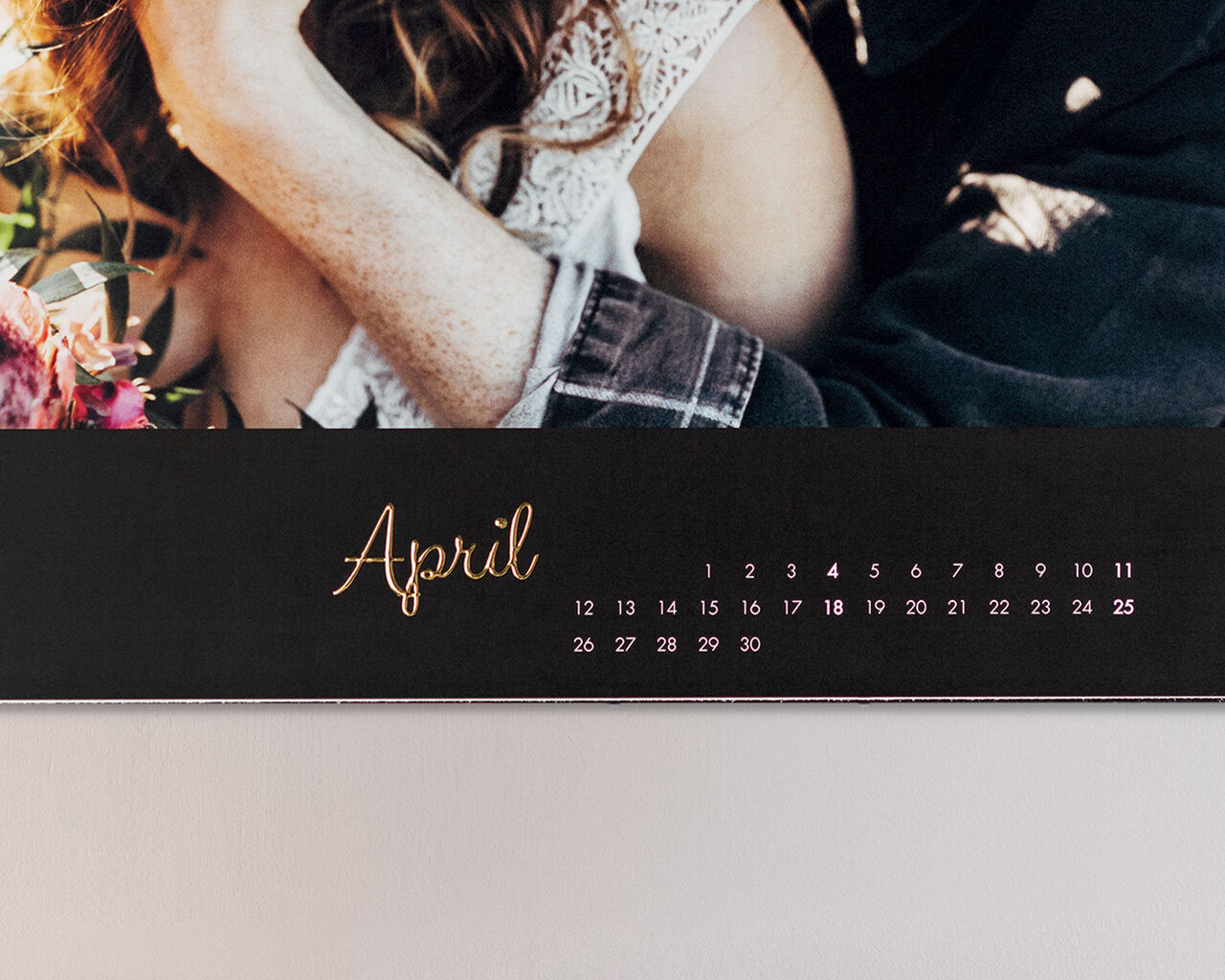 Detail of a calendar for April with elegant script.