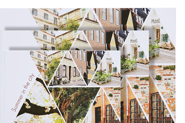 A creatively designed CEWE photo book featuring colorful images from city trips.