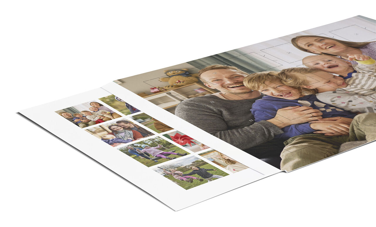 A smiling family photo in the CEWE photo book showing happy moments
