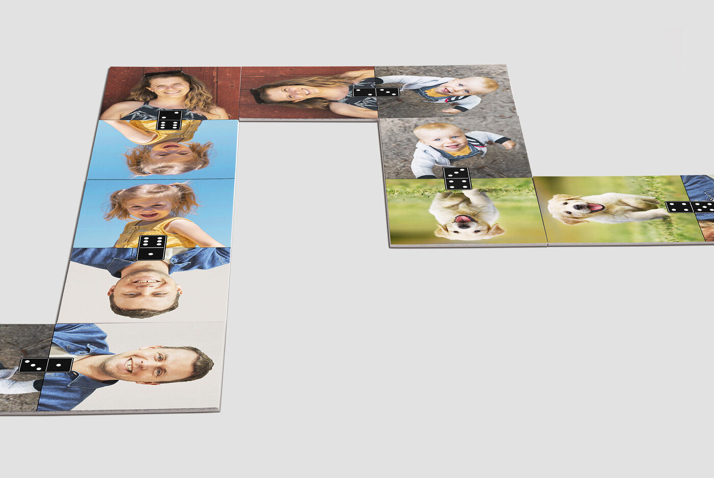 A creative photo puzzle with happy faces and animals on the individual pieces