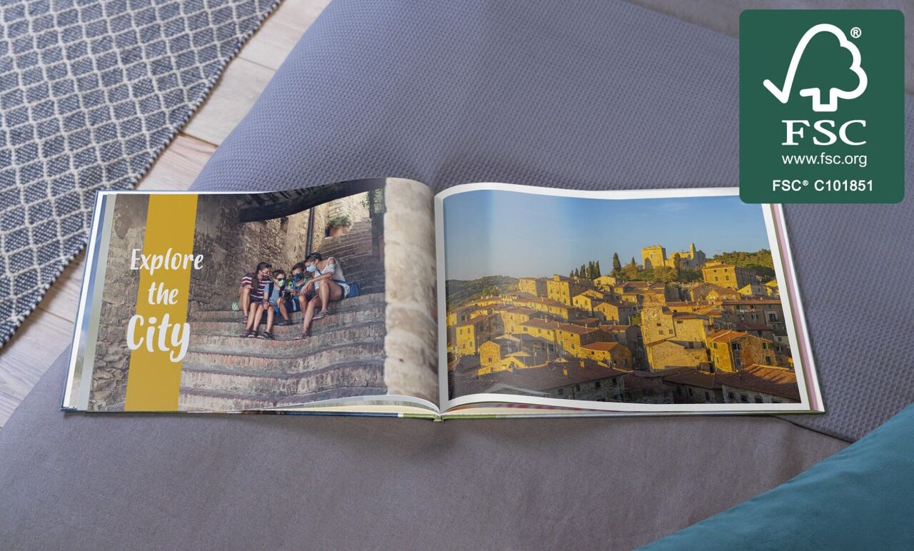 Open photo book shows city exploration with kids surrounded by architecture.