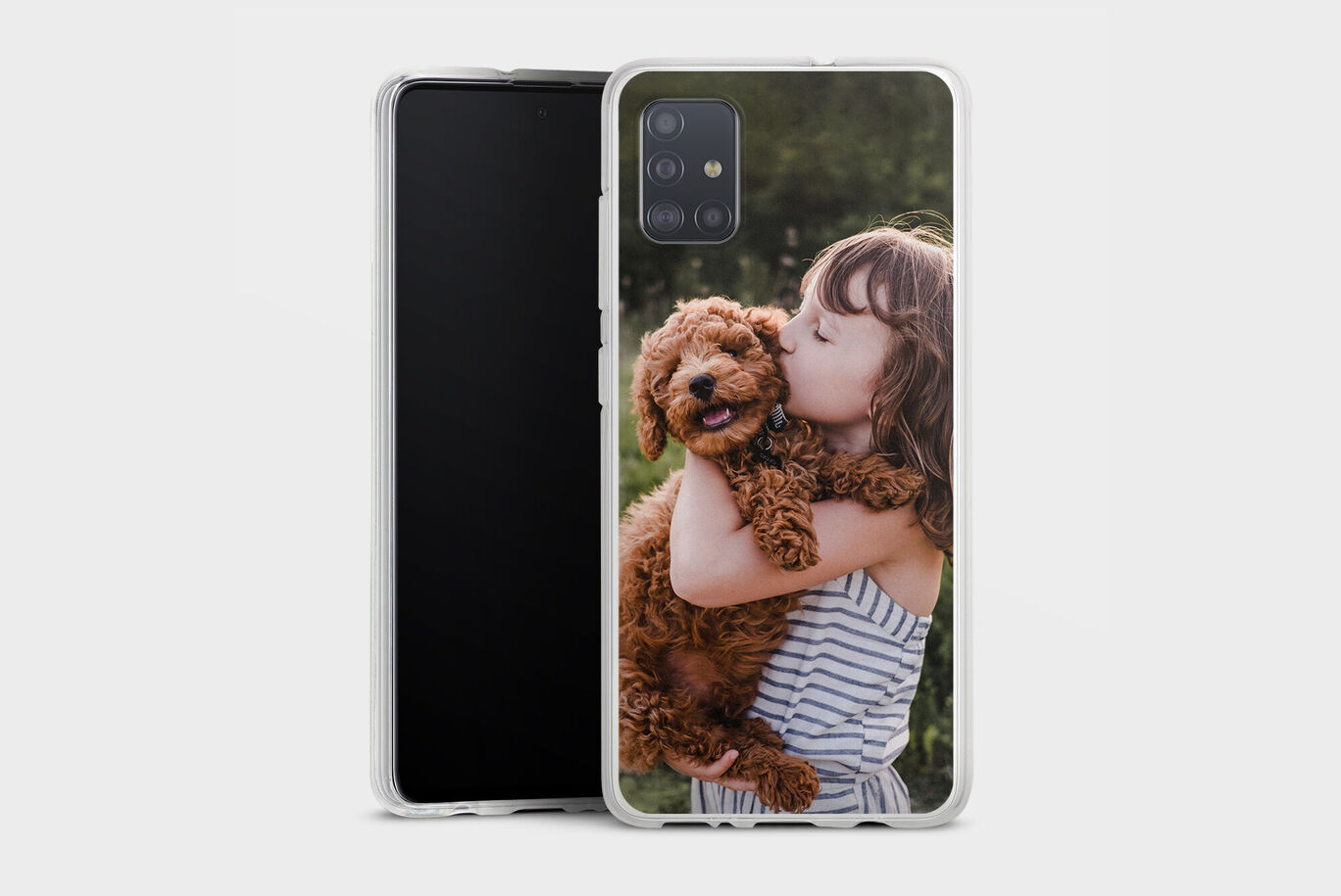 A happily smiling child hugs a sweet, brown dog outdoors.