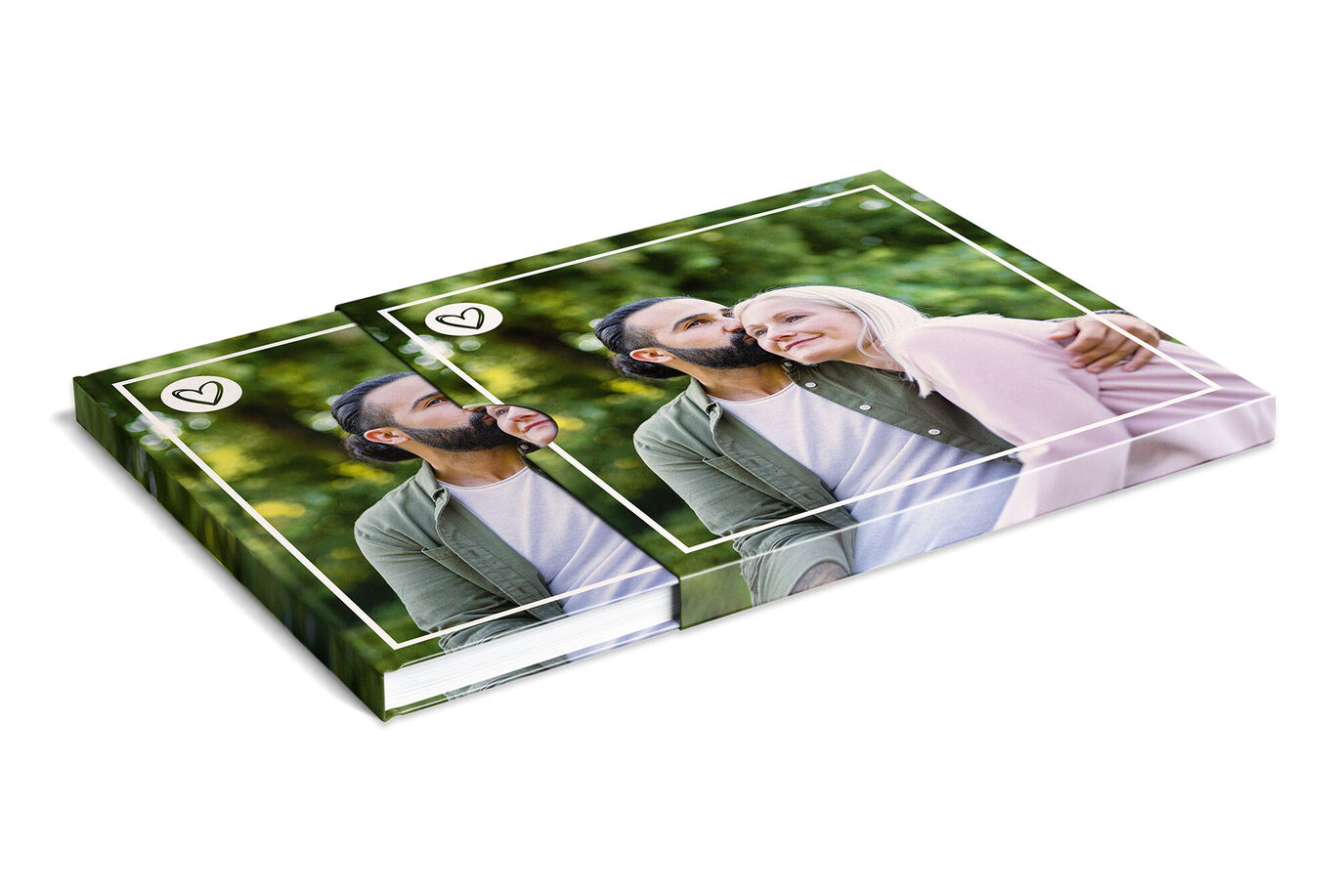 A lovely photobook showing two smiling people embracing happily. Blurry green trees are in the background.