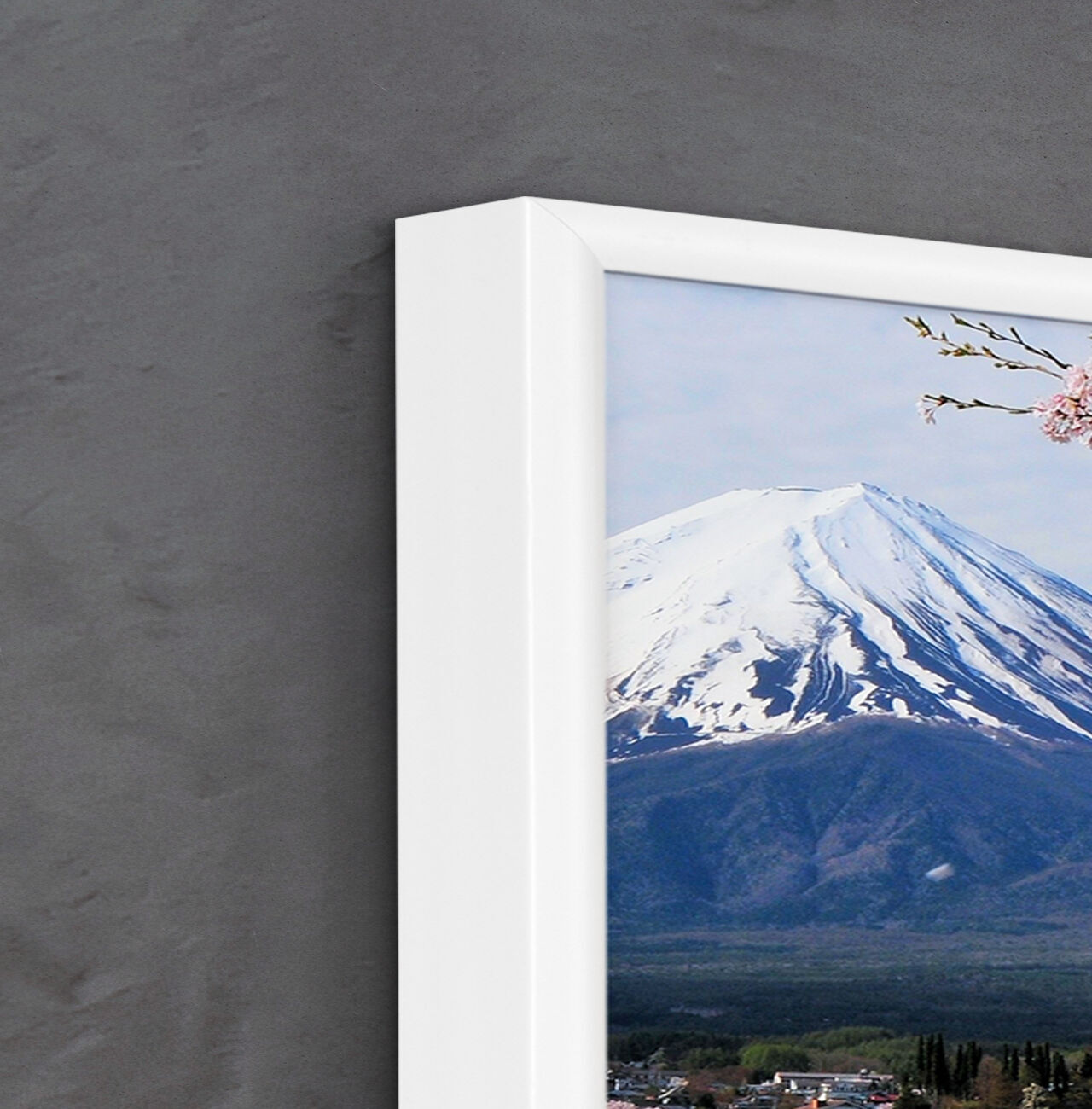 A wall decoration with a view of snowy Mount Fuji and blooming flowers in the foreground.