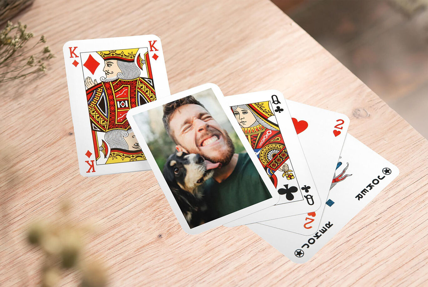 A relaxed card game scene with playing cards and a loving moment.