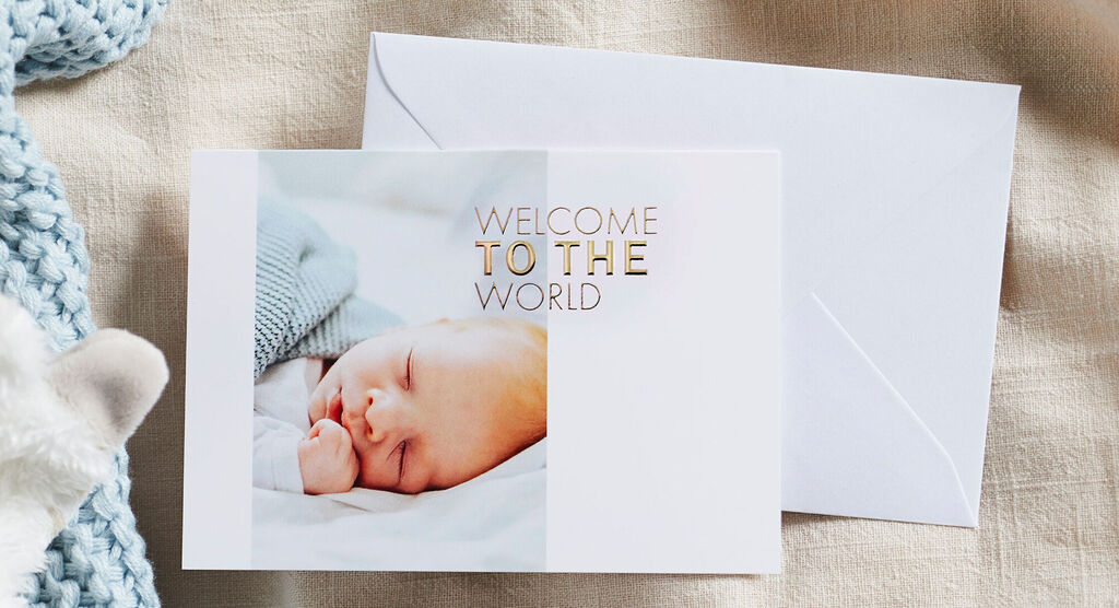 A sleeping baby on a card with the text 'Welcome to the World'.