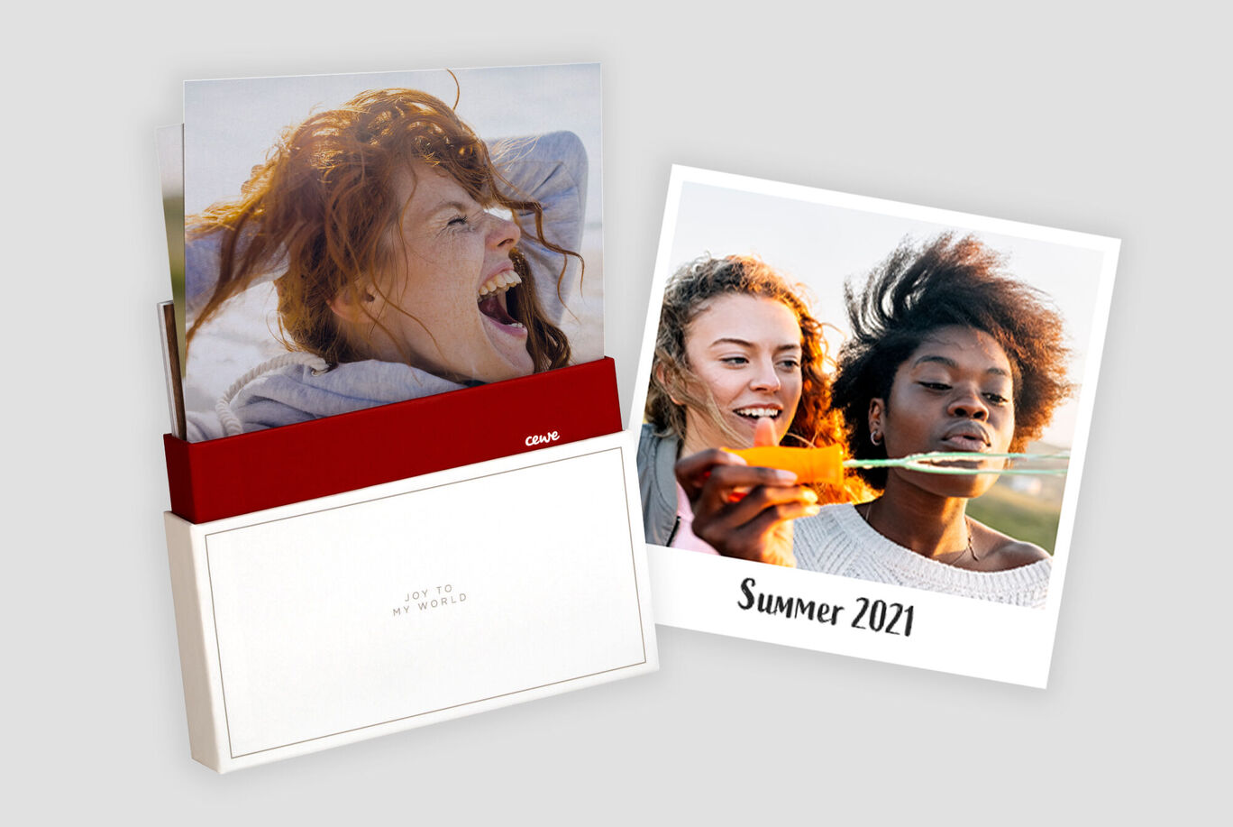 Two photo books on a table, one showing the title 'Summer 2021'.