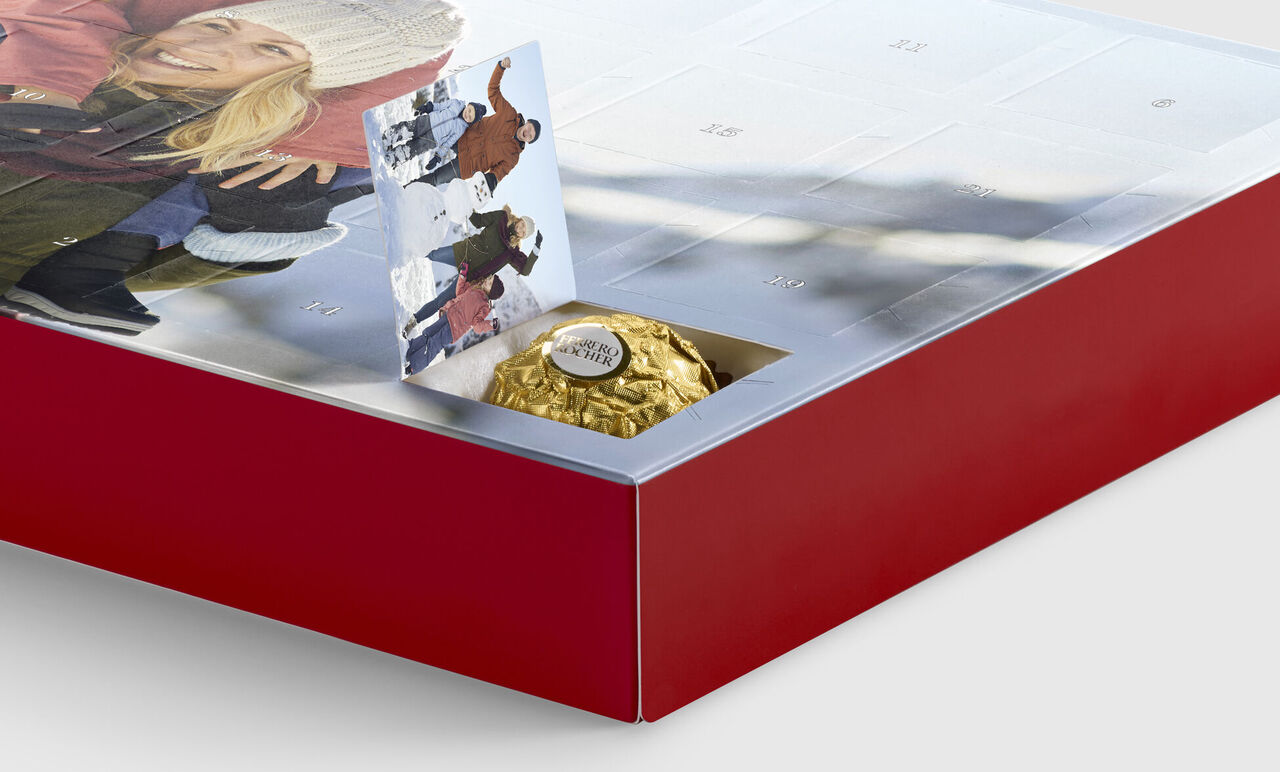 CEWE Advent calendar with chocolate and a greeting card for joyful holidays.