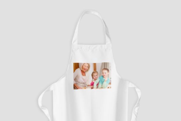 A beautiful white kitchen towel with a photo of a child and an adult. Both are smiling and enjoying time together in the kitchen.