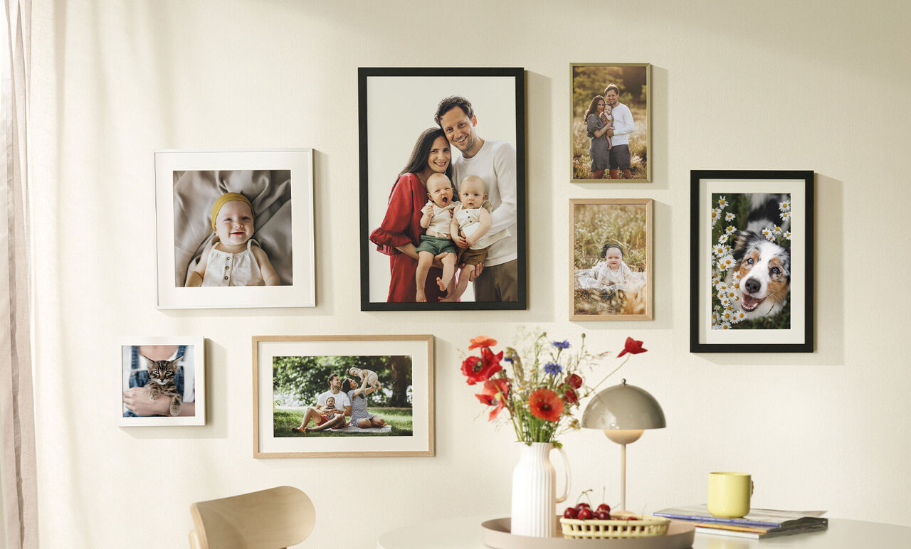 Wall art with photos of family moments and a dog.