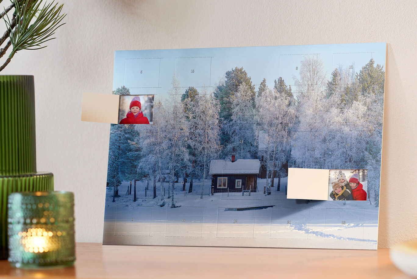 A beautiful snowy background with a small red wooden house surrounded by snow-covered trees.