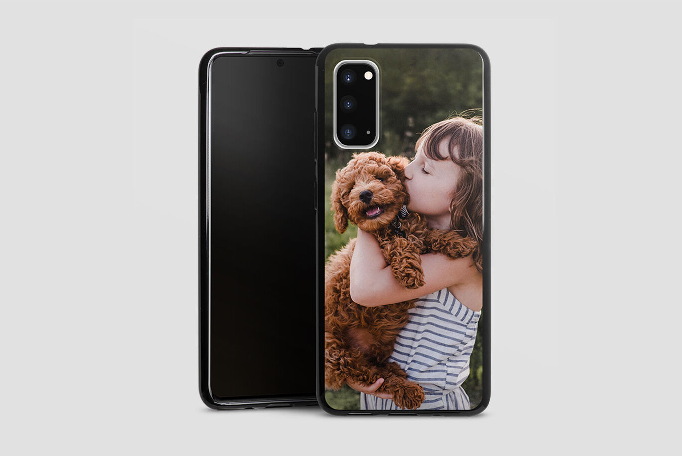 A smartphone with a case designed with an image of a dog and a child outdoors.