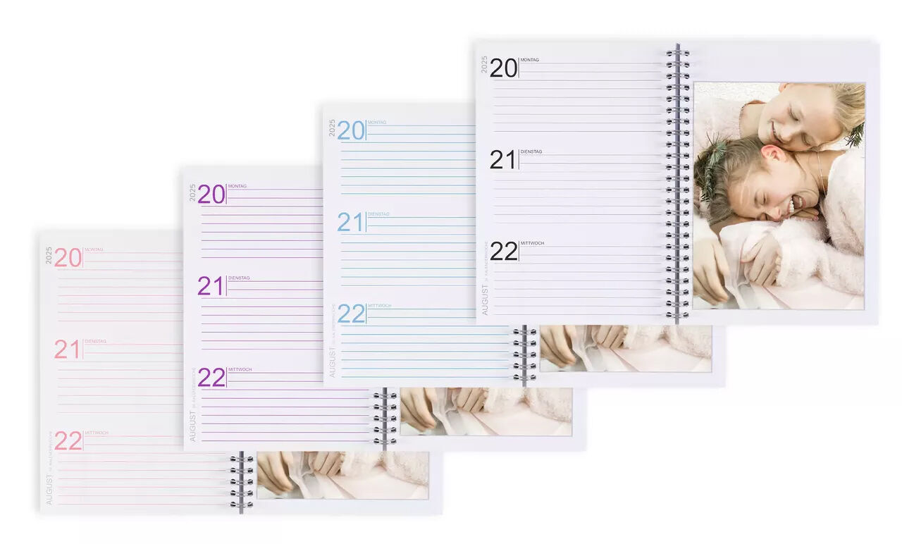 A photo calendar with four pages and an image of two sleeping people