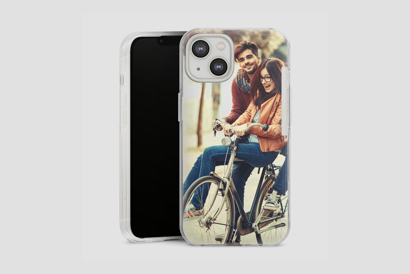 Couple on a bike with a personalized phone case in the foreground.