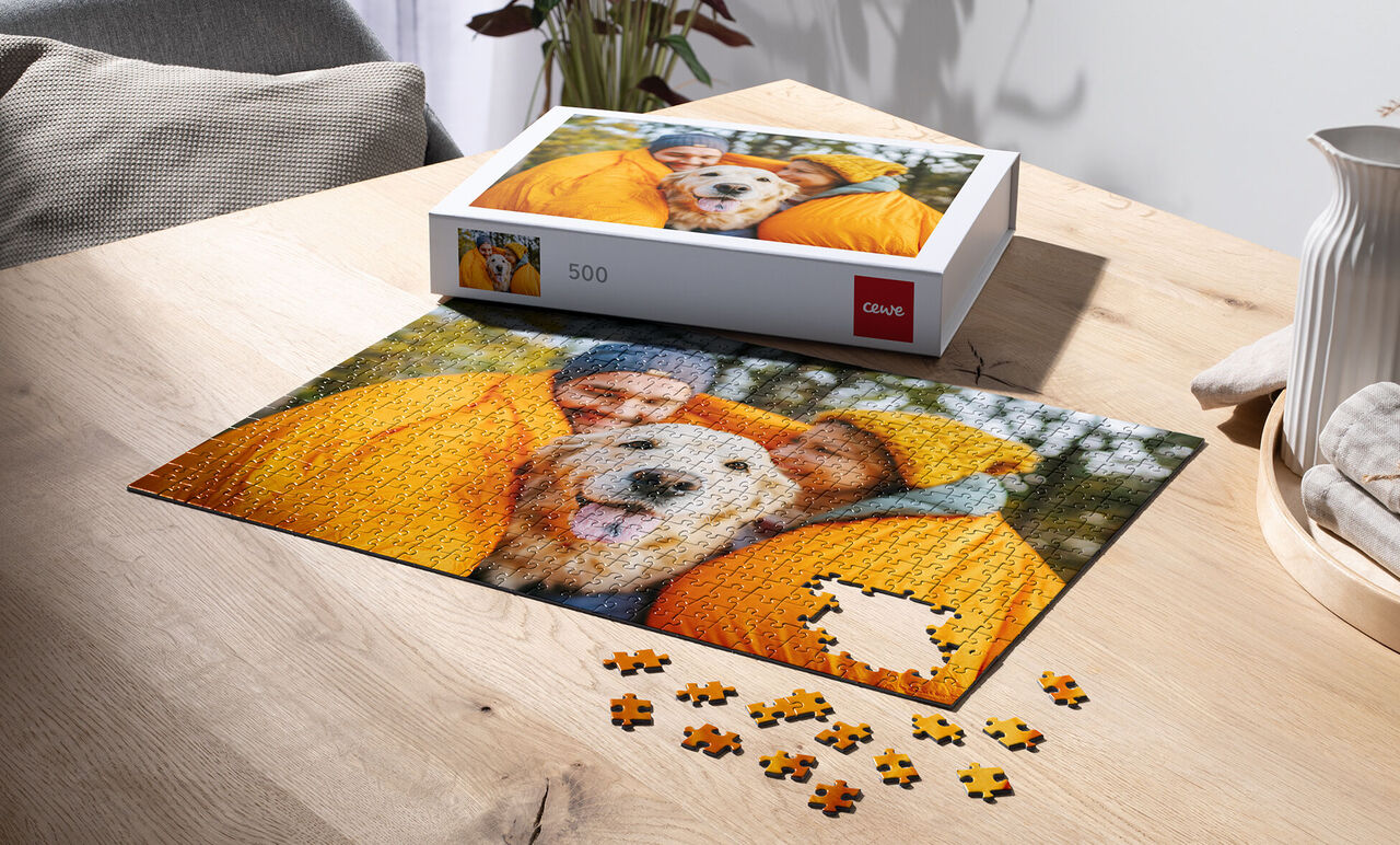 Puzzle game with a picture of a happy family and a dog in yellow coats