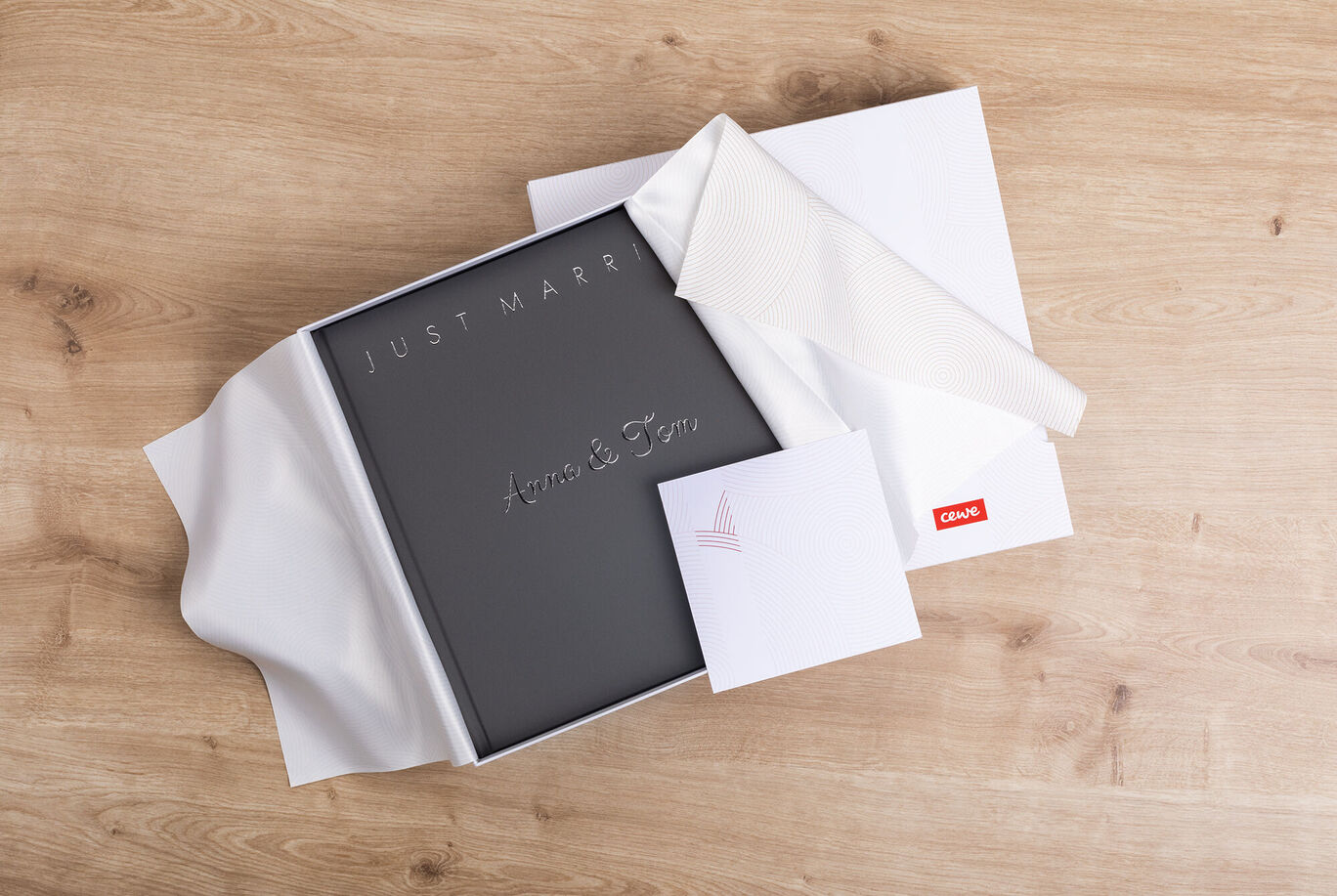 A romantic photo book titled 'Just Married', lovingly packed in a white box, ready for gifting