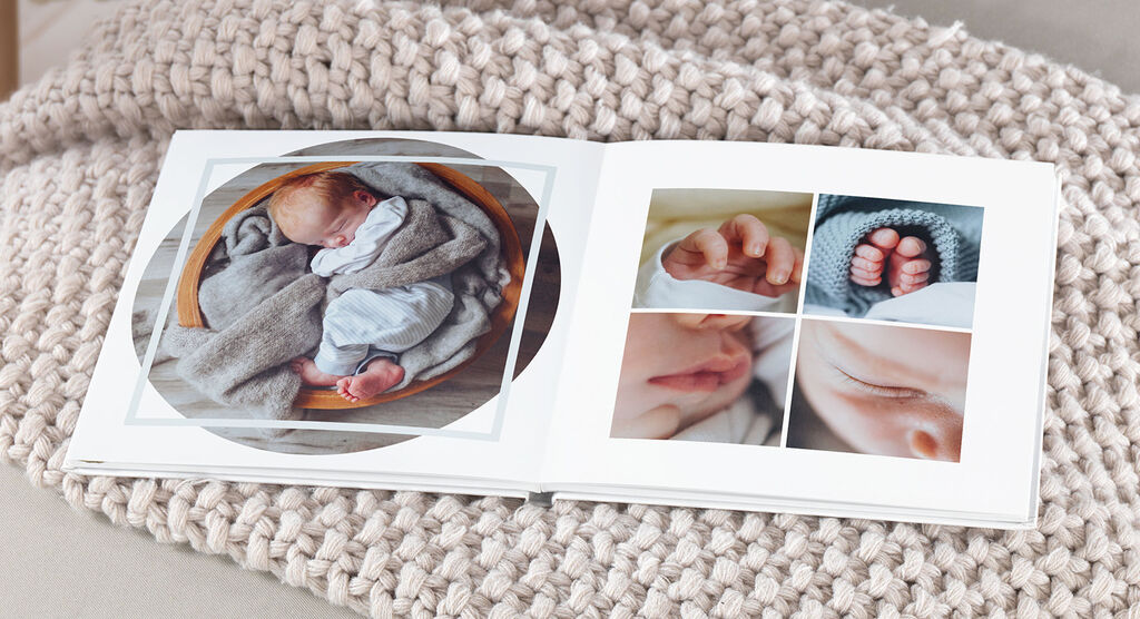 An opened CEWE photo book shows delicate baby photos, including hands and feet.