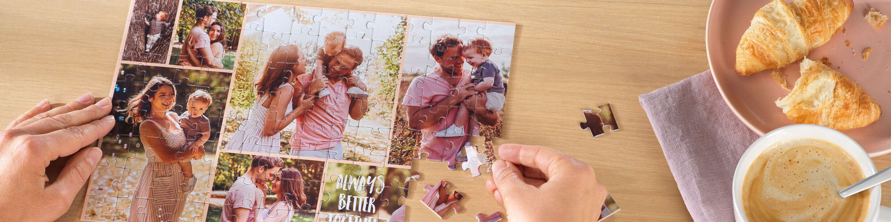 Hands assemble a puzzle with family photos on a table.