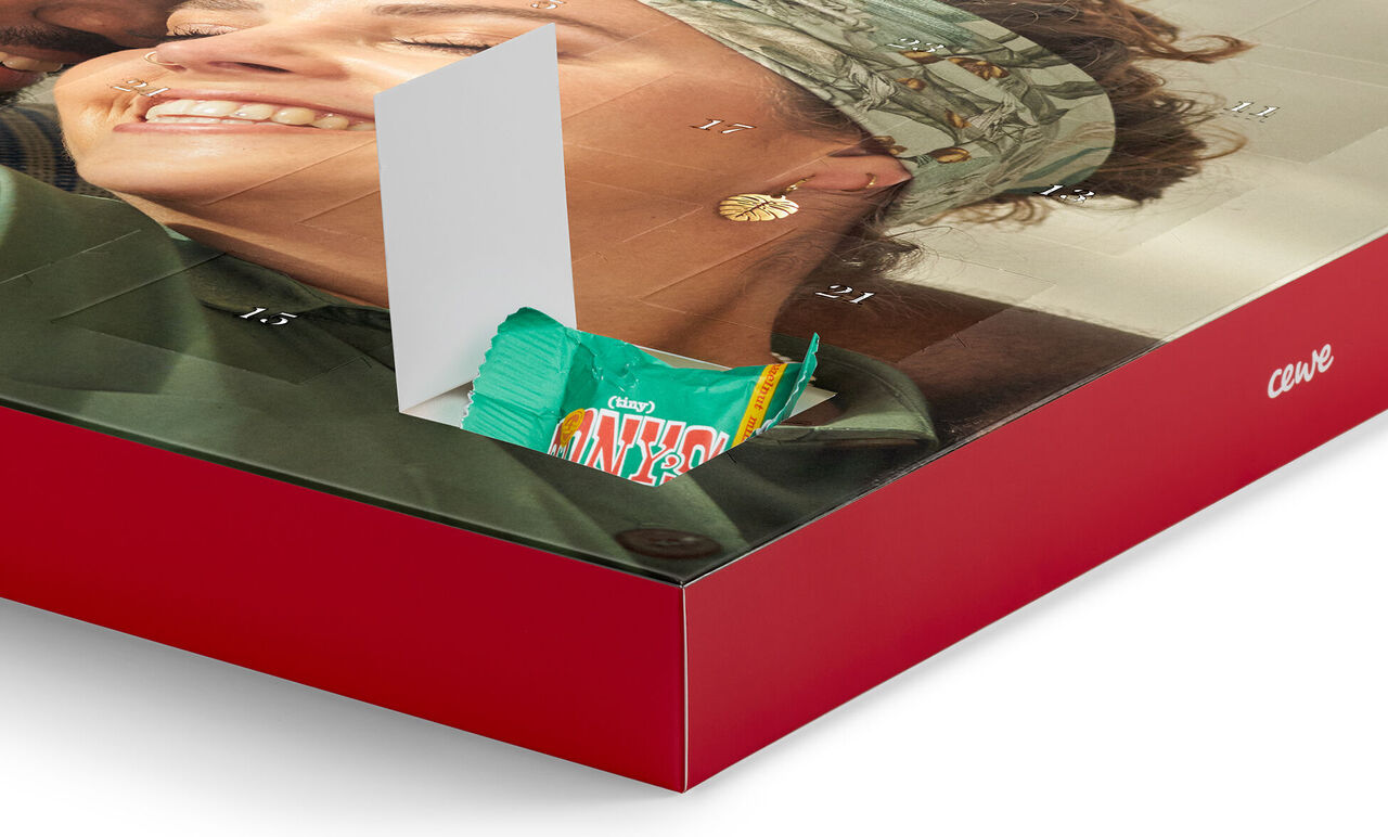 Advent calendar with a sweet gift. Visible joy and surprise.