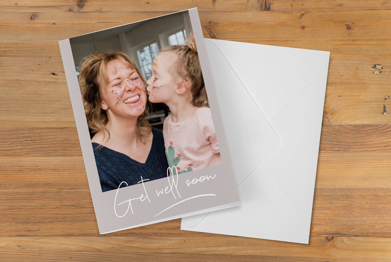 A lovely girl-themed greeting card with 'Get well soon' text alongside an open white envelope.