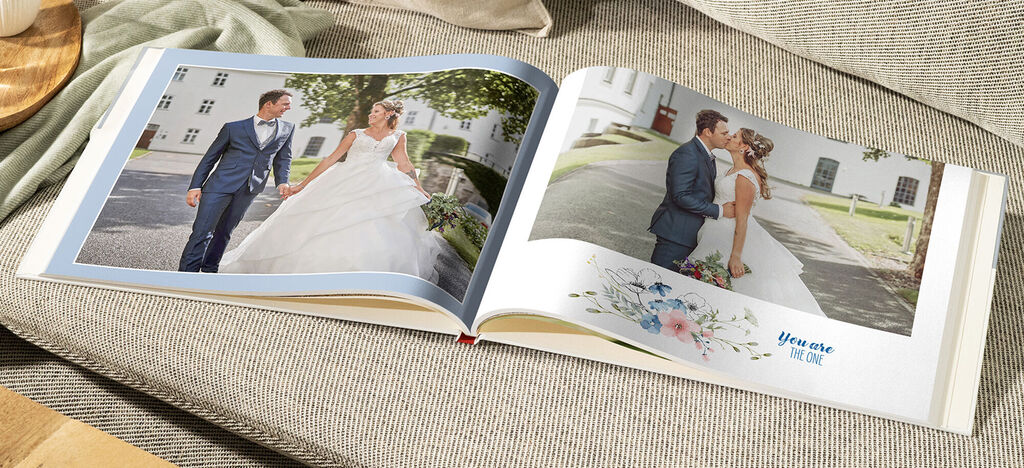 Wedding photo book with a couple walking on a beautiful path.