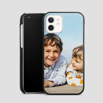 Two smiling children on a phone cover with colorful motifs