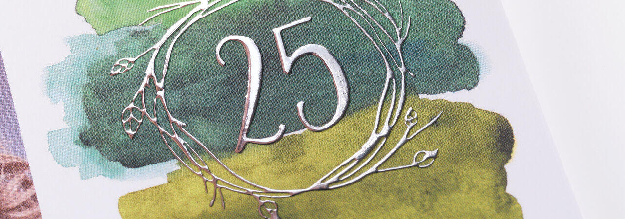 An elegant greeting card design with the number 25 in silver, surrounded by green and yellow watercolor colors.