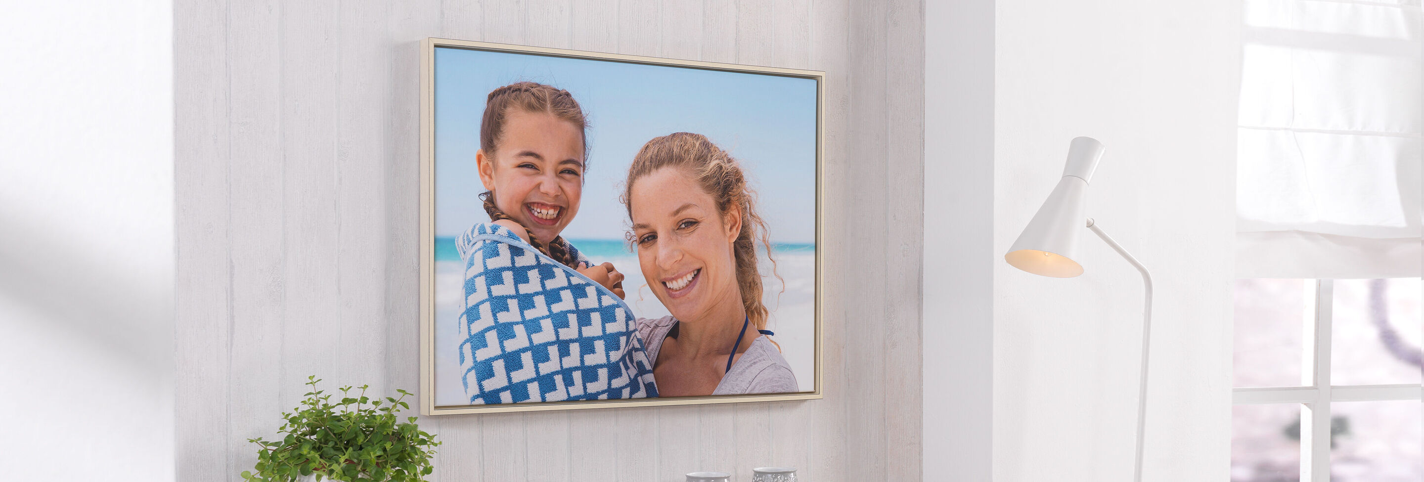 A beautiful wall art featuring two people against a beach background.