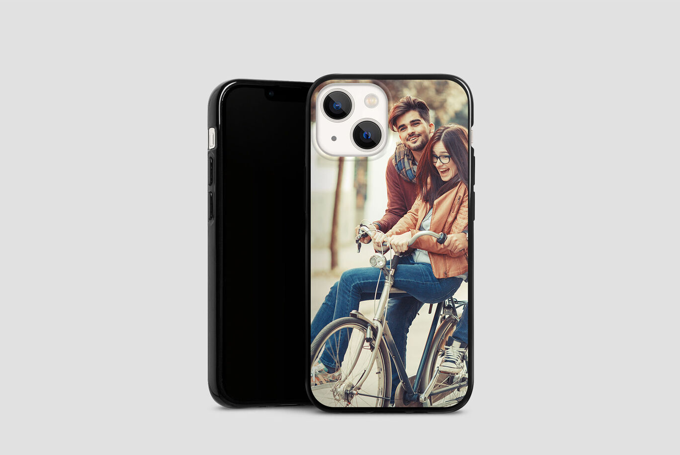 A personalized phone cover shows a couple cycling happily outdoors.