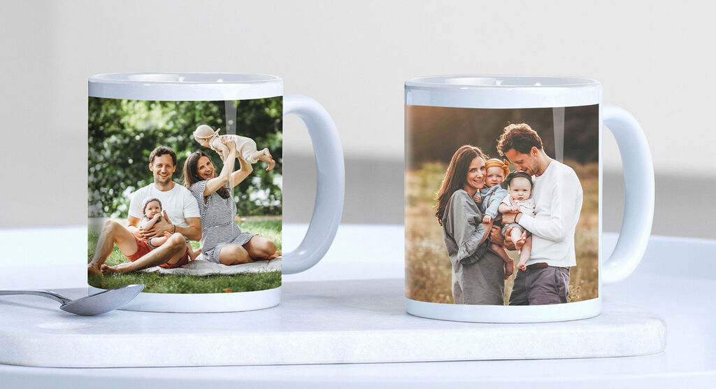 Two mugs with photos of happy family moments, a picnic in the park and a heartwarming family trip