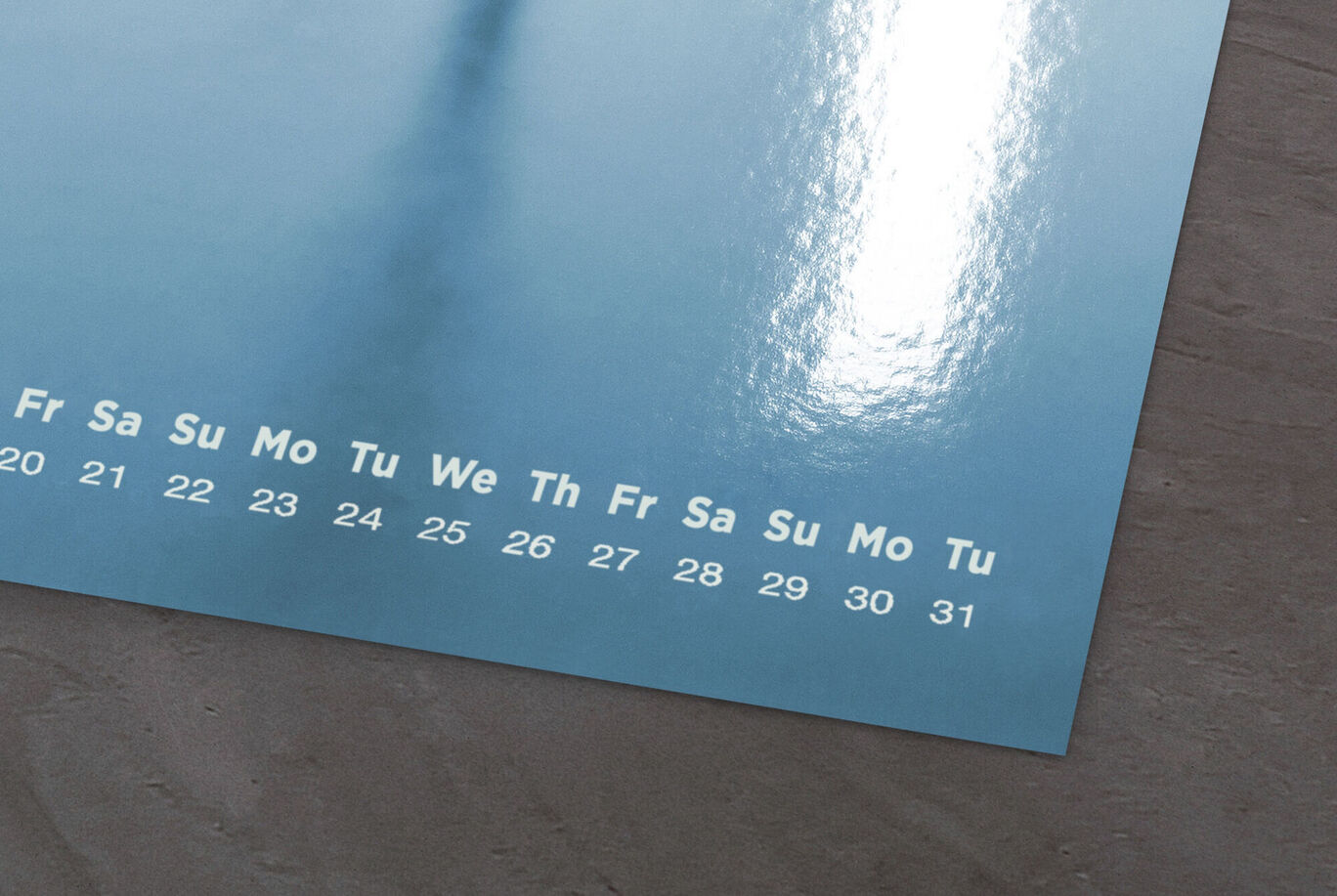 Calendar page with blue surface and date in white text