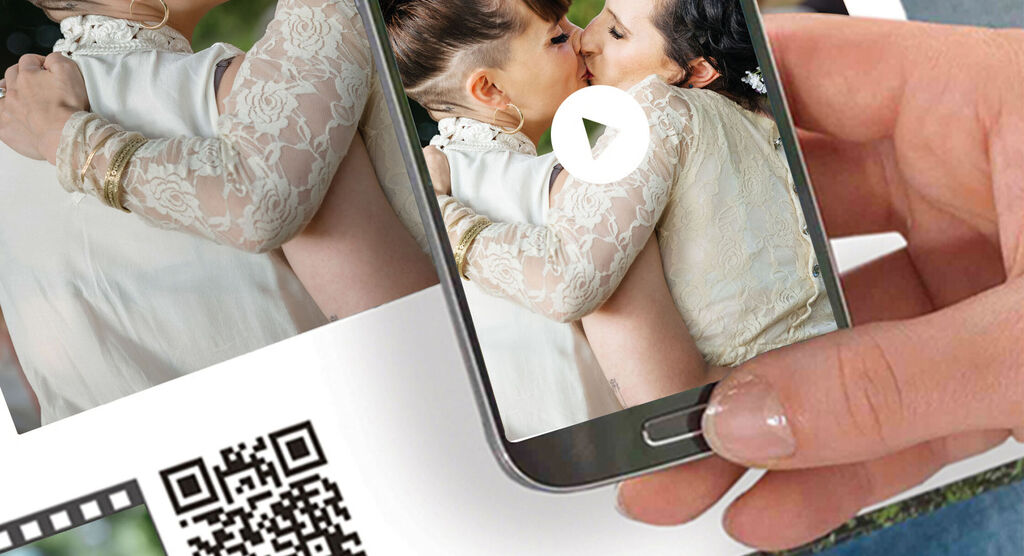 A person holds a smartphone to show a photo.