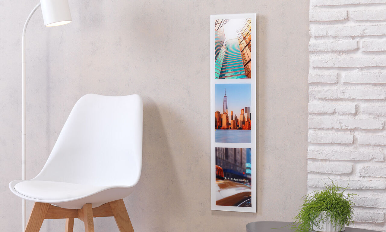 Bright, modern room with three photos on the wall.