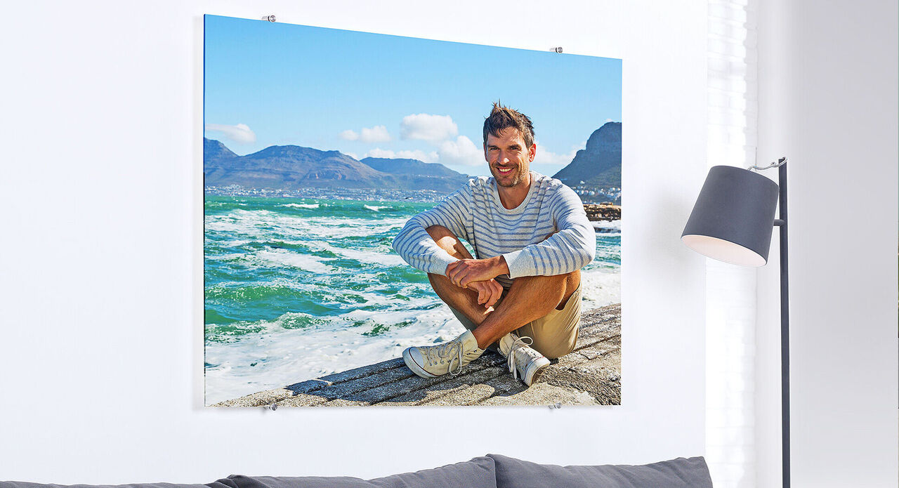 Person sits on the beach enjoying the view of the sea.
